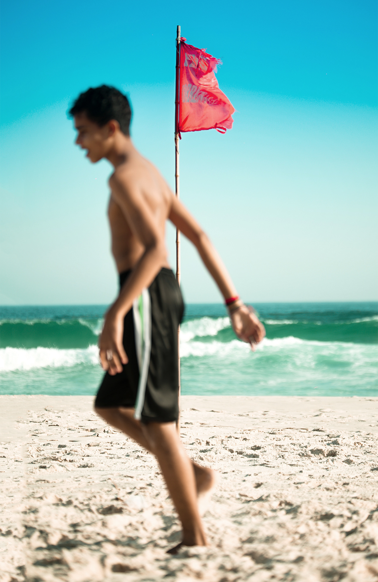 rio-de-janeiro-boy-beach-flag-brazil-sidebar
