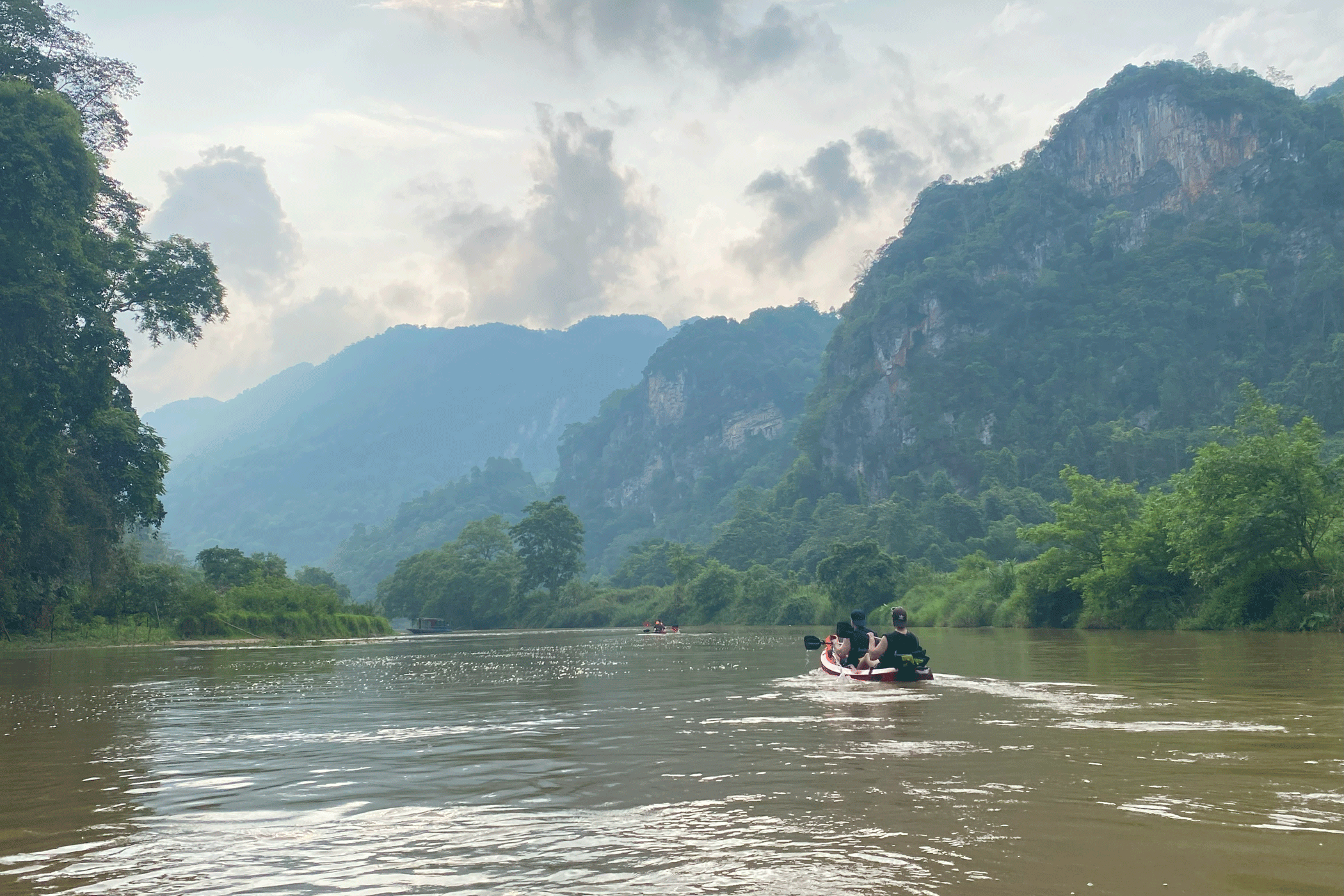 Travellers In Small Boats On Ba Be Lake In Vietnam