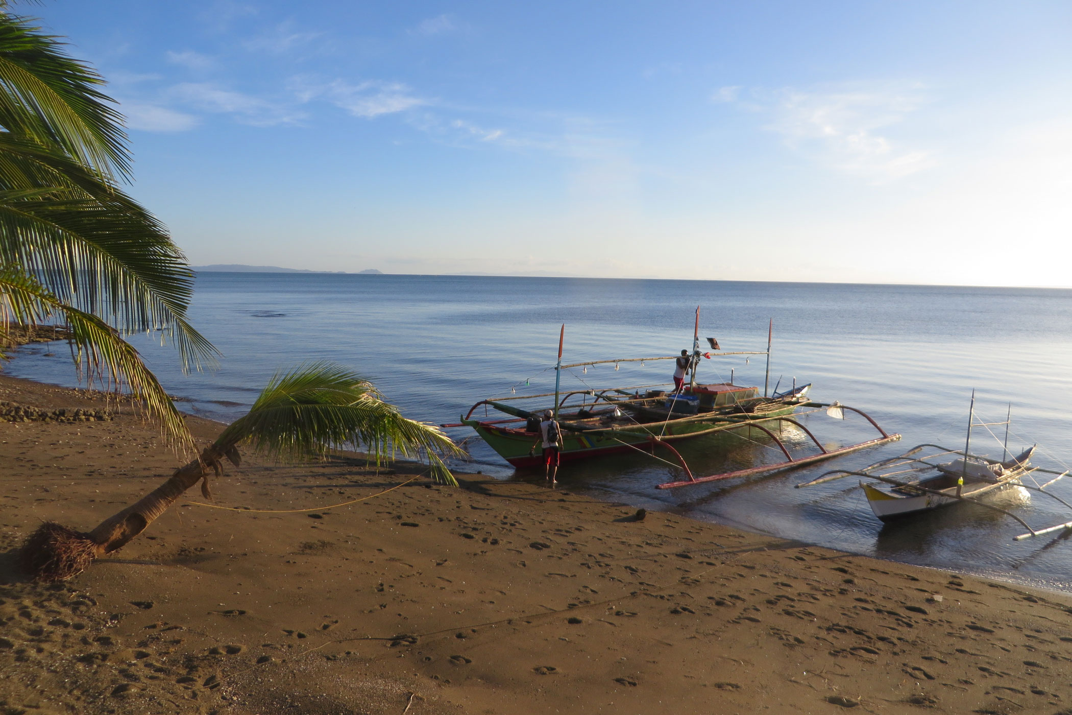 Traditional Fishing Boats On A Sandy Beach In The Philippines