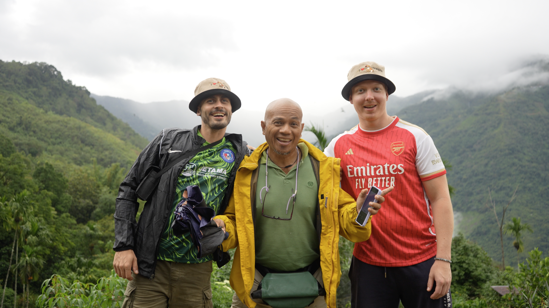 Girl standing on a mountaintop overlooking a mountainous view in the Balkans