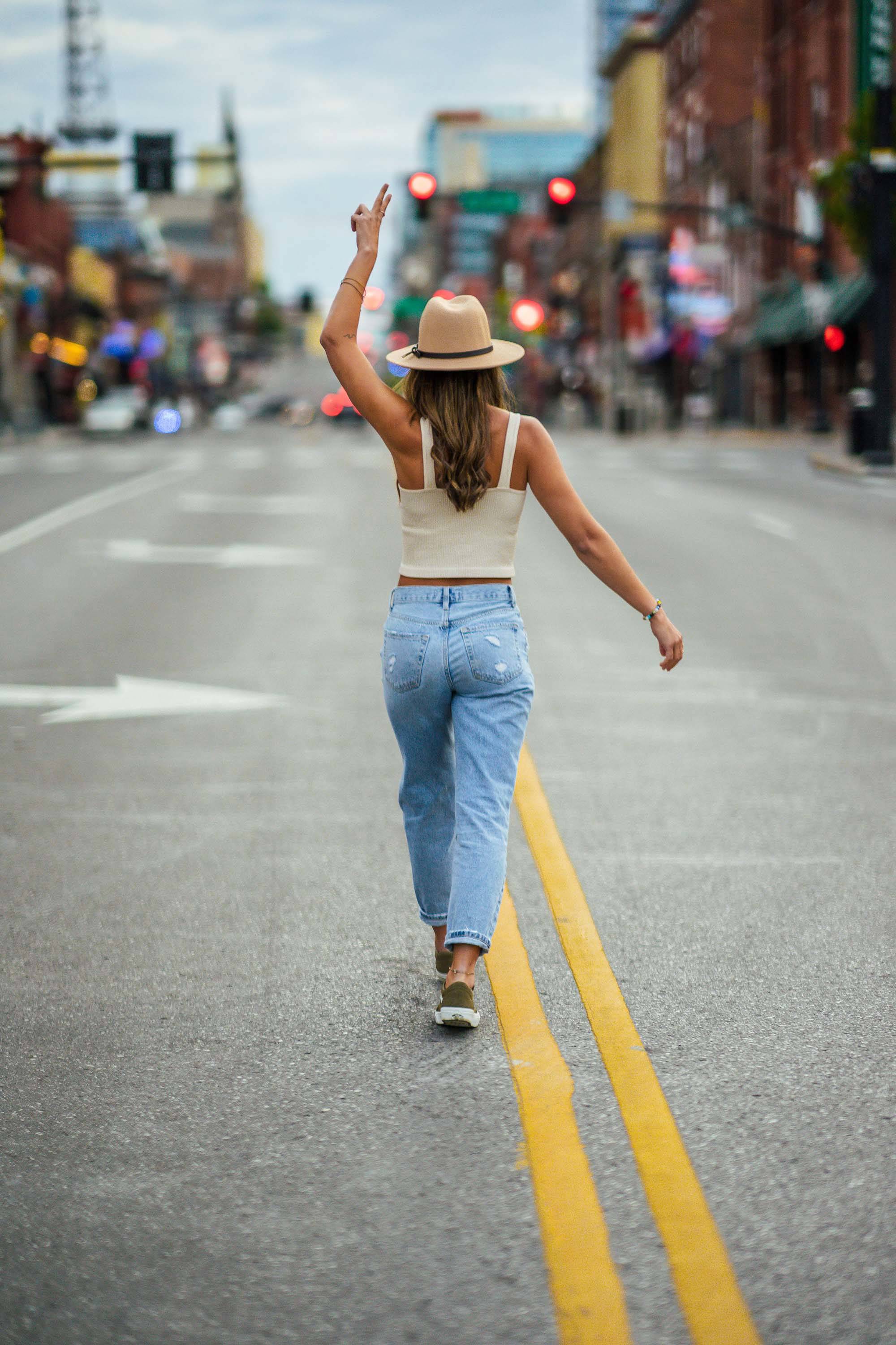 Girl walking up the street in Nashville