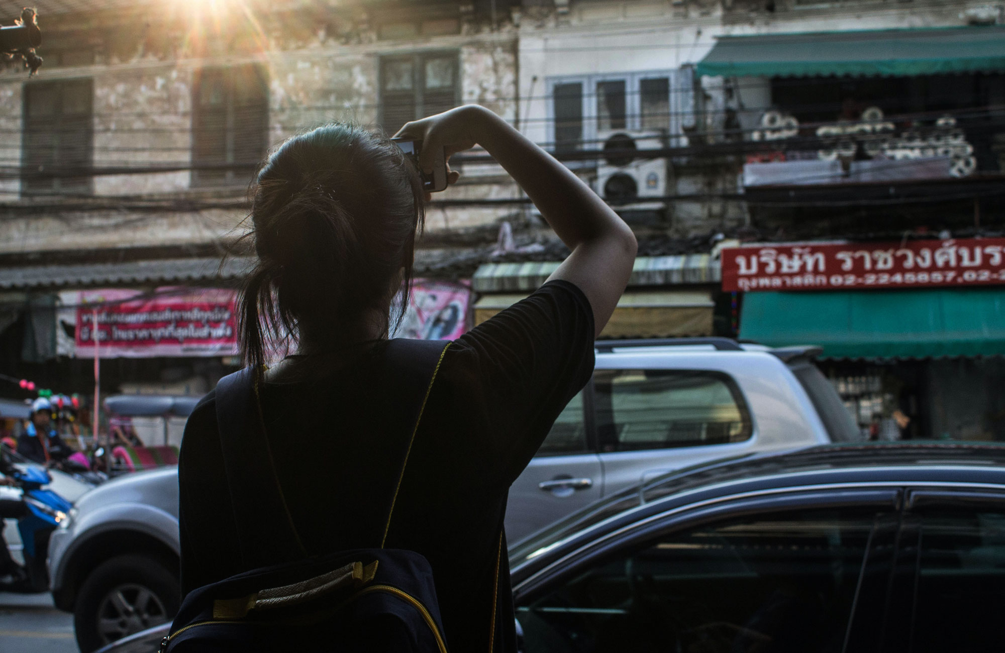 Woman Alone In Bangkok On A Busy Street